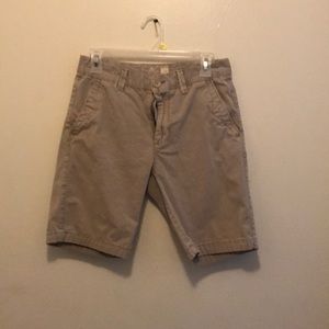 A pair of tan shorts